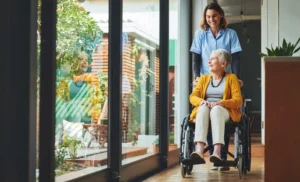 Nurse assisting a senior lady on a wheelchair